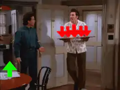 Kramer slides pizza on table