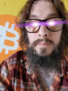 Bearded man with glowing eyes and bitcoin