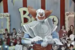 Bozo the Clown dancing on stage