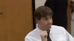 Michael Scott nodding with pen