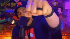 Man doing finger gun and fist bump