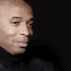 Bald man smirking and nodding