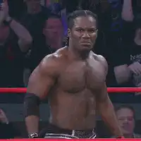 Kane smirks in wrestling ring