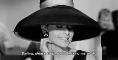 Audrey Hepburn blushing