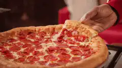 Pepperoni pizza slice with cheese pull
