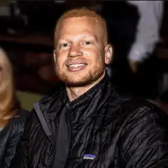 Jesse Eisenberg smiling with glitch effect