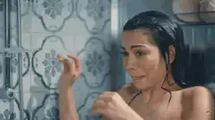 Woman crying in the shower
