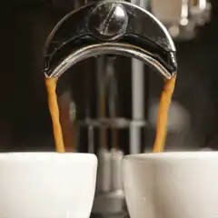 espresso pouring into two cups
