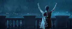 Woman raising arms in rain with lightning