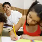 Boy staring at girl in class