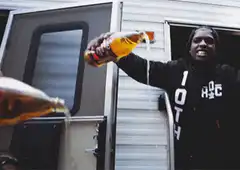 Man pouring drinks from bottles