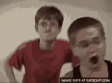 Two boys making funny faces and gestures