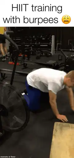 Man doing burpees in gym