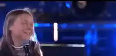 Greta Thunberg singing on stage