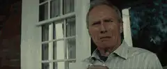 Clint Eastwood squinting and looking away