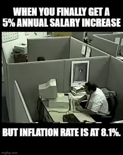 Office worker slumps at desk inflation