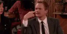 Barney Stinson pointing to his head