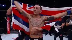 UFC fighter celebrates with flag and belt