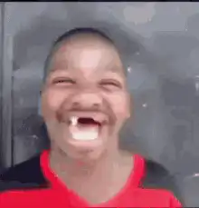 Boy laughing with vampire teeth