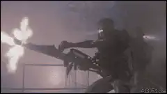 Soldier firing a large gun in smoke