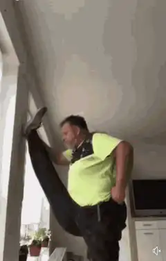 Man does a split and pulls down pants