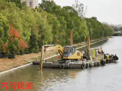 Yellow excavator dredging river
