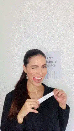 Woman laughs and throws paper