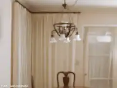 Man adjusts glasses and looks at camera