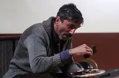 Man eating oysters with tears