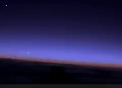 Glowing UFO over clouds