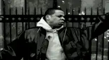 Jay-Z arms wide in black and white