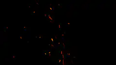 Orange sparks flying in the dark