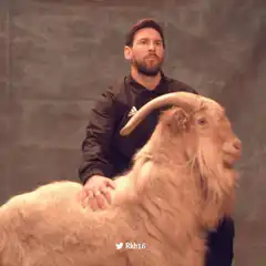 Lionel Messi with a goat