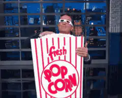 man eating popcorn with 3d glasses