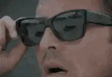 Tony Stark puts on sunglasses
