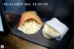 McDonald's fries and burger in microwave