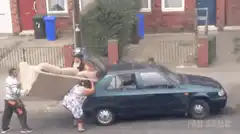 people trying to fit sofa in car