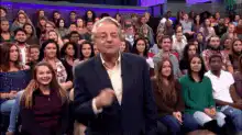 Larry King clapping with audience