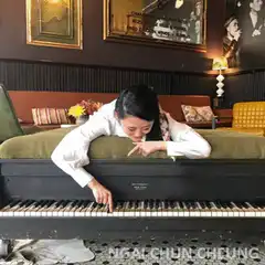 Woman playing piano with one finger