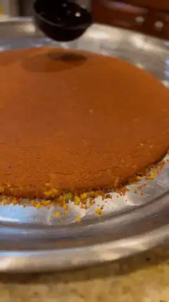 Ladling syrup over cake