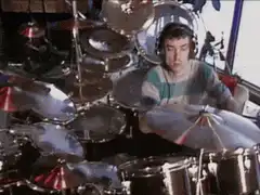 Man playing drums intensely