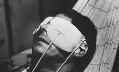 Man in hammock with eye patch