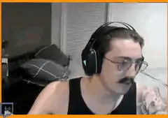 Man throws off headphones and laughs