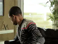 Man eating popcorn on couch