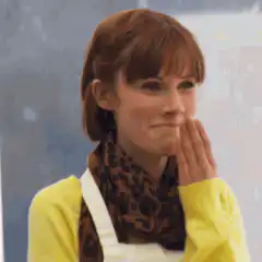 Woman in yellow sweater giggling
