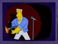 Sideshow Bob plays guitar with a flamethrower