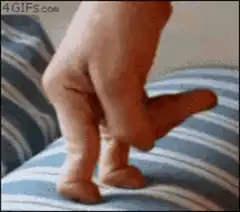 Hand puppet walking on striped fabric