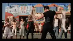 Tony Montana whipping a woman