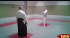 Karate guy bows to aikido master