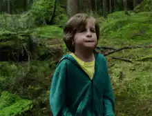 Boy in forest doing happy dance